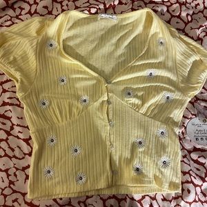 yellow button up shirt with flowers